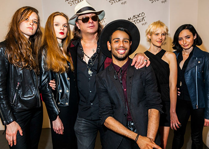 Photo of six guests posing inside the gallery.